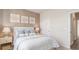 Well-lit bedroom with neutral tones, soft bedding, and classic decor at 128 Dagger Ct., Myrtle Beach, SC 29588