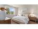 Cozy bedroom with a comfortable bed, natural light, and rustic-style decor at 128 Dagger Ct., Myrtle Beach, SC 29588