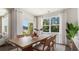 Elegant dining room with large windows offering scenic views and plenty of natural light at 128 Dagger Ct., Myrtle Beach, SC 29588