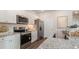 Well-equipped kitchen featuring stainless steel appliances and granite countertops at 128 Dagger Ct., Myrtle Beach, SC 29588