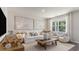 Cozy living room featuring neutral decor, comfortable seating, and abundant natural light at 128 Dagger Ct., Myrtle Beach, SC 29588