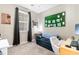 Bedroom with a cozy chair, desk, and large window at 1298 River Oaks Dr. # 5-I, Myrtle Beach, SC 29579