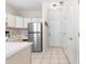 Functional kitchen includes appliances and ample storage space adjacent to tiled entryway and hallways at 1298 River Oaks Dr. # 5-I, Myrtle Beach, SC 29579