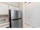Kitchen features a stainless steel fridge, microwave and ample cabinet space at 1298 River Oaks Dr. # 5-I, Myrtle Beach, SC 29579