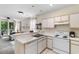 Open-concept kitchen overlooking living area and balcony, blending cooking, dining, and relaxation space at 1298 River Oaks Dr. # 5-I, Myrtle Beach, SC 29579
