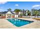 Community swimming pool with clear blue water, surrounded by lounge chairs and well-maintained landscaping at 1298 River Oaks Dr. # 5-I, Myrtle Beach, SC 29579
