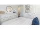 Comfortable bedroom with a white dresser, black modern accents, and a queen-sized bed with decorative pillows at 136 Dagger Ct., Myrtle Beach, SC 29588