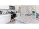 Close up of a kitchen featuring granite countertops, stainless steel appliances and white cabinetry at 136 Dagger Ct., Myrtle Beach, SC 29588