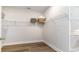 Spacious walk-in closet with wood-look floors and ample shelving for organized storage at 149 Stride Ct., Myrtle Beach, SC 29588