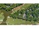 Aerial view of a community on a golf course featuring a pond and lush greenery at 159-1 Weehawka Way # 159-1, Pawleys Island, SC 29585