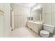 Bathroom featuring striped wallpaper, tile floor, vanity, and a shower-tub combination at 159-1 Weehawka Way # 159-1, Pawleys Island, SC 29585