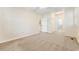 Bedroom with neutral carpet featuring hallway doors and access to the en-suite bathroom at 159-1 Weehawka Way # 159-1, Pawleys Island, SC 29585