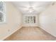 Bedroom with neutral carpet, a ceiling fan, and many windows at 159-1 Weehawka Way # 159-1, Pawleys Island, SC 29585