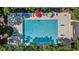 Aerial image showcasing a community pool with ample seating and umbrellas for residents at 159-1 Weehawka Way # 159-1, Pawleys Island, SC 29585