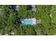 Aerial shot of community pool surrounded by trees and lounge chairs at 159-1 Weehawka Way # 159-1, Pawleys Island, SC 29585