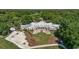 Aerial view of large home with meticulously landscaped grounds at 159-1 Weehawka Way # 159-1, Pawleys Island, SC 29585