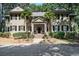 Charming home featuring brick entrance, lush landscaping, and inviting front porch at 159-1 Weehawka Way # 159-1, Pawleys Island, SC 29585