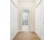 Hallway with access to the en-suite bathroom and closet space at 159-1 Weehawka Way # 159-1, Pawleys Island, SC 29585