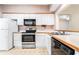 Practical kitchen equipped with stainless steel appliances and ample cabinet storage at 159-1 Weehawka Way # 159-1, Pawleys Island, SC 29585