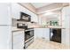 Well-lit kitchen offering updated stainless steel appliances and efficient layout at 159-1 Weehawka Way # 159-1, Pawleys Island, SC 29585