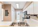 Traditional kitchen with white cabinets, stainless steel appliances, and double sink at 159-1 Weehawka Way # 159-1, Pawleys Island, SC 29585