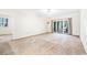 Bright living room featuring sliding glass doors, and carpeted floors at 159-1 Weehawka Way # 159-1, Pawleys Island, SC 29585