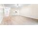 Large living room featuring carpeted floors, white walls, and backyard views at 159-1 Weehawka Way # 159-1, Pawleys Island, SC 29585