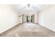Spacious living room with large sliding glass doors leading to outdoor deck at 159-1 Weehawka Way # 159-1, Pawleys Island, SC 29585