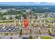 This aerial shows a location pin over townhomes near the ocean and bordering a forest at 1600 Deer Creek Rd. # F, Myrtle Beach, SC 29575