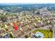 An aerial view of a community with townhomes, featuring mature trees, water features, and convenient parking at 1600 Deer Creek Rd. # F, Myrtle Beach, SC 29575