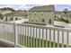 This backyard has a white fence with a sliding glass door to enter into the house at 1600 Deer Creek Rd. # F, Myrtle Beach, SC 29575