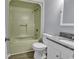 This bathroom features a tub and shower combination with a white vanity and granite countertop at 1600 Deer Creek Rd. # F, Myrtle Beach, SC 29575