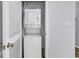 A close up of a stacked white washer and dryer inside a closet at 1600 Deer Creek Rd. # F, Myrtle Beach, SC 29575