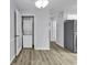 Laundry nook with stacked washer and dryer, conveniently located near the kitchen at 1600 Deer Creek Rd. # F, Myrtle Beach, SC 29575