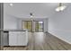 Bright living space with hardwood floors, ceiling fan, and a sliding door to the outdoor deck at 1600 Deer Creek Rd. # F, Myrtle Beach, SC 29575