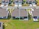 An aerial view of the home's backyard with a screened patio, landscaping, and green lawn at 1631 Hepburn Dr., Little River, SC 29566