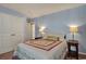 Bedroom features a comfortable bed, side tables, and ample natural light from a window at 1631 Hepburn Dr., Little River, SC 29566