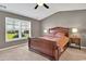 Cozy bedroom featuring a large window providing natural light and plush carpet at 1631 Hepburn Dr., Little River, SC 29566