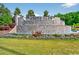 The community entrance sign is adorned with colorful flowers and a cascading waterfall feature at 1631 Hepburn Dr., Little River, SC 29566