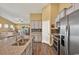 Open kitchen with stainless appliances, granite counters, and view to a living room with water views at 1631 Hepburn Dr., Little River, SC 29566