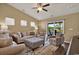 Cozy living room with comfortable furniture, neutral color palette, and a sliding door with water views at 1631 Hepburn Dr., Little River, SC 29566