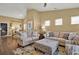 Bright and airy living room with a high ceiling, comfortable seating, and natural light at 1631 Hepburn Dr., Little River, SC 29566
