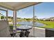 Relax on the screened patio with beautiful views of the serene pond and water feature at 1631 Hepburn Dr., Little River, SC 29566