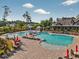 Resort-style pool featuring lounge chairs, shade umbrellas and an adjacent clubhouse for residents at 1631 Hepburn Dr., Little River, SC 29566