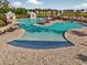 Beautiful community pool with lounge chairs, umbrellas and a view of the adjacent pond at 1631 Hepburn Dr., Little River, SC 29566