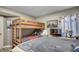 This is a bedroom with a bunk bed and a queen bed with gray colored linens at 1990 N Waccamaw Dr. # 1008, Murrells Inlet, SC 29576