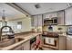 Updated kitchen features stainless steel appliances, granite countertops, and plenty of storage space at 1990 N Waccamaw Dr. # 1008, Murrells Inlet, SC 29576