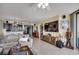 Inviting living room featuring an open floor plan, modern décor, and plenty of natural light from the sliding door at 1990 N Waccamaw Dr. # 1008, Murrells Inlet, SC 29576