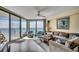 Comfortable living room with expansive ocean views, balcony access, and stylish furnishings at 1990 N Waccamaw Dr. # 1008, Murrells Inlet, SC 29576
