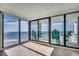Spacious balcony with stylish outdoor seating, offering stunning ocean views through sliding glass doors at 1990 N Waccamaw Dr. # 807, Murrells Inlet, SC 29576